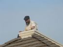 Rabbi Abend preparing the roof to collect the rain Rabbi Abend preparing the roof to collect the rain